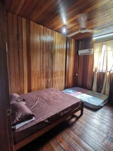 Vuode tai vuoteita majoituspaikassa AK HOMESTAY