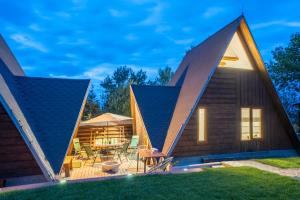 a house with two large pitched roofs at AKORD chata in Námestovo