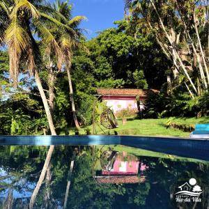 - une vue sur la maison depuis la piscine dans l'établissement Pousada Rio da Vila, à Porto Seguro