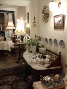 a room with a table with dishes on the wall at Ben View Guesthouse in Clifden