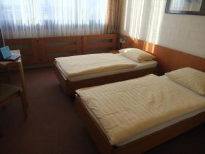 A bed or beds in a room at RTB-Hotel - Sportschule