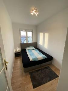 Posteľ alebo postele v izbe v ubytovaní City Apartment Tulln