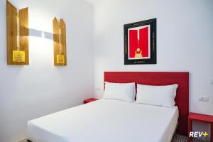 Cama ou camas em um quarto em Lia Art Hotel