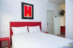 Cama ou camas em um quarto em Lia Art Hotel