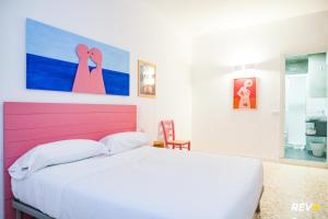 Cama ou camas em um quarto em Lia Art Hotel