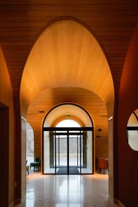 an open hallway with an archway in a building at Hotel La Briosa in Bolzano