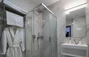 a bathroom with a shower and a sink at Hotel Anastasia in Sibiu