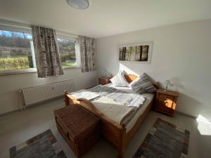 A bed or beds in a room at Kleine Elbequelle