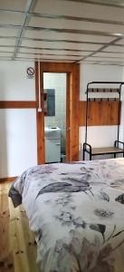 Cama ou camas em um quarto em Alojamento Raminho dos Açores