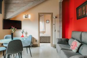 a living room with a couch and a table at Apartamentos Villa Fresnedo in Solares