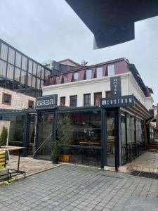 a storefront of a restaurant in front of a building at Hotel Castrum in Skopje