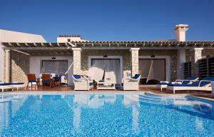 The swimming pool at or close to Aldemar Olympian Village