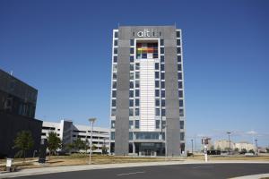 a hotel building with a sign on top of it at Alt Hotel Toronto Airport in Mississauga