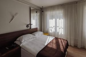 Tempat tidur dalam kamar di Hotel Skeppsholmen, Stockholm, a Member of Design Hotels