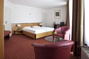 Cama ou camas em um quarto em Hotel Am Braunen Hirsch