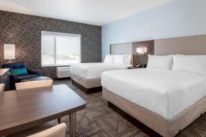 A bed or beds in a room at TownePlace Suites Amarillo West/Medical Center