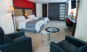 A bed or beds in a room at Hotel HR AMADA Cúcuta