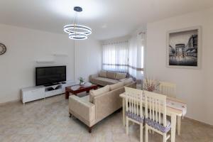 TV at/o entertainment center sa Spacious 2 bedroom apartment in Durres Beach