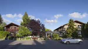 a silver car parked in front of a house at Hotel Blumenbach in Berlin