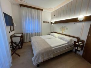 Krevet ili kreveti u jedinici u objektu Hotel Miralago Wellness - Adults Only