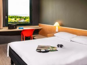 Giường trong phòng chung tại Hotel Ibis Firenze Prato Est