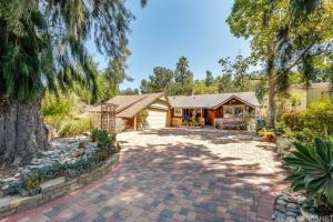 a house with a brick driveway in front of a house at Villa La Reforma - Newly Designed 4BR HOUSE & POOL in Los Angeles by Topanga in Los Angeles