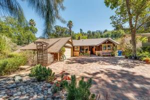 a home with a large driveway in front of a house at Villa La Reforma - Newly Designed 4BR HOUSE & POOL in Los Angeles by Topanga in Los Angeles