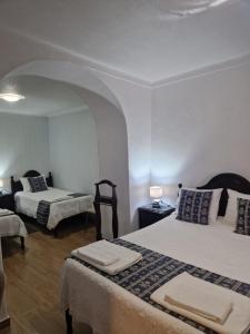 Кровать или кровати в номере Residencial Antonio Mocisso Guesthouse