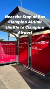 a bus stop with a sign that says next the stop of busarmaarma initiative at Pit stop Ciampino Station in Ciampino