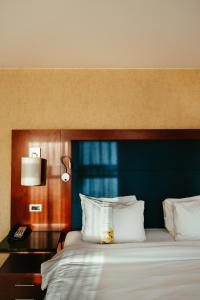 Cama ou camas em um quarto em Ghent Marriott Hotel