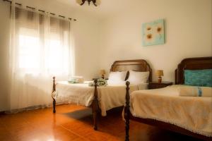 A bed or beds in a room at Apartamento Rosa