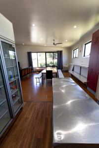 a living room with a table and a dining room at Bellarine Lodge Sleeps 30 in Drysdale