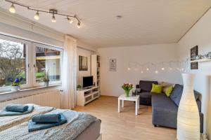 a living room with a bed and a couch at Wächtersberg in Wildberg