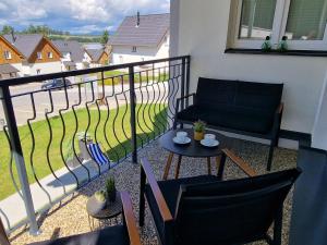 En balkong eller terrasse på Deluxe Apartment Lipno - Lake Side Village, Frymburk nad Vltavou