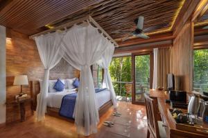 Cama ou camas em um quarto em Sacred Valley by Pramana Villas