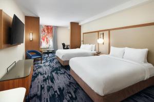 Krevet ili kreveti u jedinici u objektu Fairfield Inn & Suites Worcester Auburn