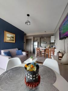 a living room with a table with a cake on it at Departamento Torre Murguía in San Salvador de Jujuy