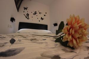 a bedroom with a bed with butterflies on the wall at FP HOTELs in Alcalá de Henares