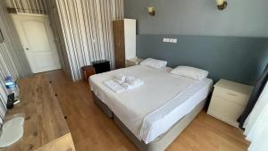 Krevet ili kreveti u jedinici u okviru objekta Tabiat Park Hotel Ayvalik