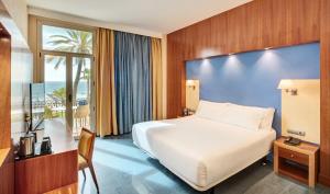 Cama ou camas em um quarto em Sercotel Kalma Sitges