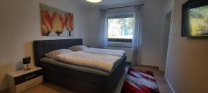 Una cama o camas en una habitación de Ferienhaus im Grünen/Monteurzimmer