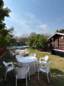 a group of tables and chairs in a yard at Namanbagh in Alwar