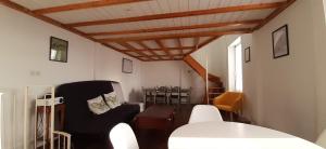 a living room with a chair and a table at Ker Karantez in Rennes