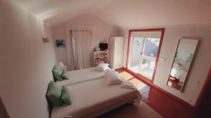 Cama ou camas em um quarto em SUN & SAND GUESTHOUSE