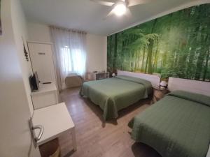 מיטה או מיטות בחדר ב-Bed & Breakfast Al Nettuno