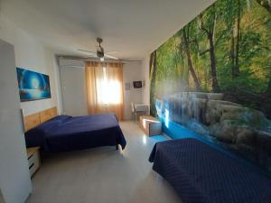 מיטה או מיטות בחדר ב-Bed & Breakfast Al Nettuno