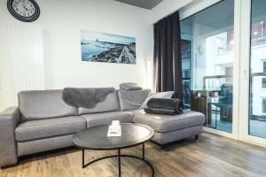 a living room with a couch and a table at Ferienwohnung Residenz Bollwark in Kappeln