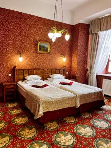 Кровать или кровати в номере Hotel Zamek Ryn