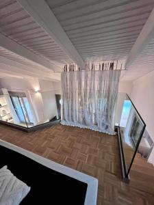 a room with a chandelier in the middle of a room at Orsalia villa wellness in Poros