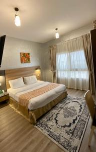 Boulevard City Suites Hotel Apartments में एक कमरे में एक या कई बेड